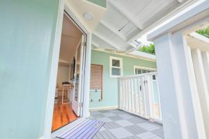 an empty hallway of a house with a balcony at Rainbow Escape & Bungalow in Honolulu