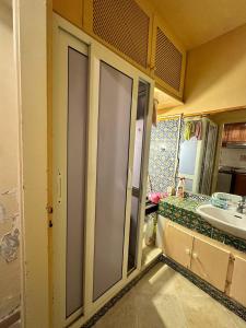 a bathroom with a sink and a mirror at Studio s0 sousse kantaoui maison de la mer in Port El Kantaoui