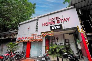 a building with motorcycles parked outside of a home stay at OYO Hotel Homestay Near Chhatrapati Shivaji International Airport in Mumbai