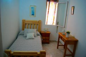 Postel nebo postele na pokoji v ubytování Hostal Sango Sierra de las Nieves