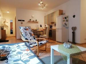 a kitchen and living room with a white refrigerator at Holiday apartment Kerstin in Selbach