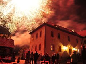 a group of people standing in front of a building with fireworks at Inviting apartment in Zell in Oppurg
