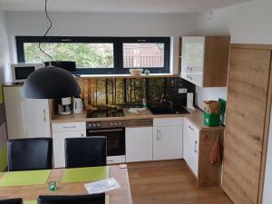 Η κουζίνα ή μικρή κουζίνα στο Gutsweg One - Apartment 3