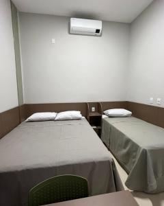 a hospital room with two beds and a fan at HOTEL XANGRILÁ in Salinas