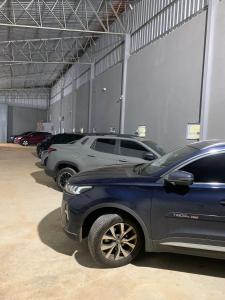 a row of parked cars in a garage at HOTEL XANGRILÁ in Salinas