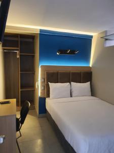 Cama ou camas em um quarto em Hotel Residencial Alfa