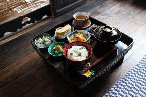 a tray of food on a table with food at Bed & Breakfast Tsukiya in Kyoto