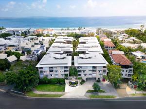 an aerial view of a city with houses and the ocean at Laguna on Hastings, Apartment 117, Noosa Heads in Noosa Heads