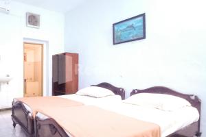 Postel nebo postele na pokoji v ubytování Hotel Palem 1 Syariah RedPartner + 25 fotografií