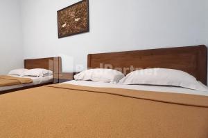 Postel nebo postele na pokoji v ubytování Hotel Palem 1 Syariah RedPartner