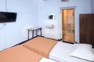 Postel nebo postele na pokoji v ubytování Hotel Palem 1 Syariah RedPartner