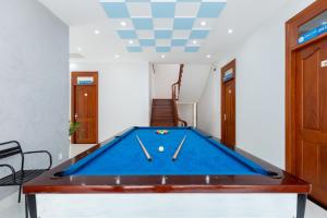 a pool table in a room with a ceiling at B2.11 Hoàng My Villa in Vung Tau