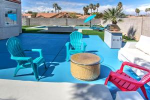 a group of chairs and a table on a patio at HOUSE VEGAS in Las Vegas