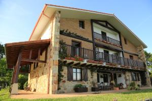 a building with balconies on the side of it at Gane Landetxea in Barrika