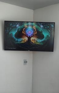 a painting of a tree on a wall at Alquimia Qi del Mar in Mar de Cobo +46 photos