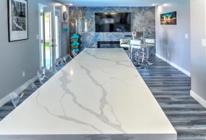 a large white marble table in a room at HOUSE VEGAS in Las Vegas