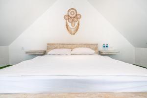 Anny Guesthouse by ecommerceloka客房内的一张或多张床位