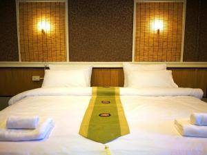Katil atau katil-katil dalam bilik di THOUSAND-TEN THOUSAND HOTEL +29 gambar