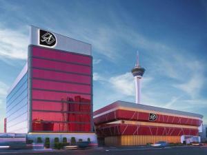 a large building with a television tower in the background at Ahern Hotel and Event Center in Las Vegas