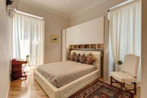 En eller flere senge i et værelse på Casa Claudia Giulio Cesare