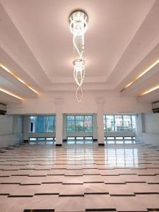 a large room with a chandelier in a building at THE SHORELINE SUBIC HOTEL in Olongapo