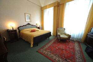Llit o llits en una habitació de Hotel Villa Kinzica
