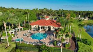 an aerial view of a resort with a swimming pool at Near Disney 7BR Home - Pool Hot Tub Games Room in Kissimmee
