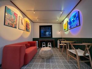 a living room with a couch and a table at Hotel First Stay Myeongdong in Seoul
