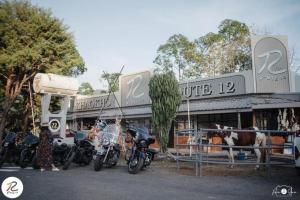 a group of motorcycles parked in front of a store at Route12 in Ban Huai Hia