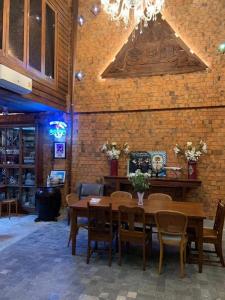 a dining room with a table and chairs at Me Design khao yai in Ban Pang Kae