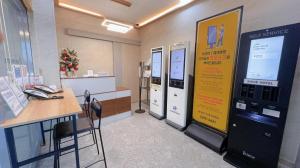 an office with a large machine in a room at Yeongjong Shine Hotel in Incheon