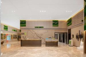 a shopping mall with two counters in a room at Home2 Suites by Hilton Xishuangbanna in Jinghong