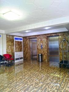 Area lobi atau resepsionis di Mine Home Hotel by SOVIA