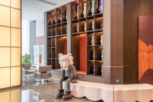 a room with a wine cellar in a building at The Puyan Hotel Hangzhou Jiubao in Hangzhou