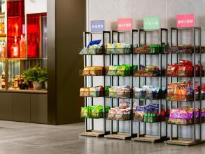 a shelf with food on it in a store at Y.TUO Hotel Universal Beijing Resort in Liyuanzhen
