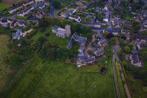 an overhead view of a large estate with houses and trees at One Bedroom Character Cottage in Farthinghoe +6 photos