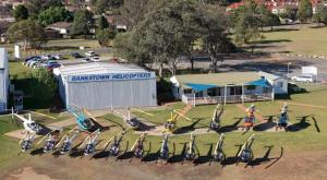 a group of airplanes parked in front of a building at Cozy Private Single Room in Carramar - Nearby Station & Shops - Shared Bathroom in Sydney