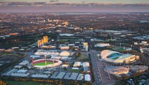an aerial view of a city with a stadium at Cozy Private Single Room in Carramar - Nearby Station & Shops - Shared Bathroom in Sydney