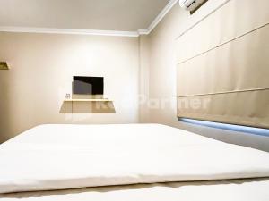 Postelja oz. postelje v sobi nastanitve Hotel Andono near YIA Mitra RedDoorz