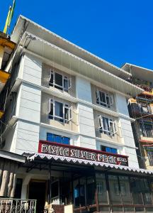 a building with a sign that reads drifting silver peak at DISHA SILVER PEAK Hotel in Pelling
