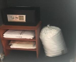 a pile of white pillows in a room at Horizon Hotel Tower One in Angeles