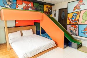 Una cama o camas en una habitación de 宜家莊親子民宿