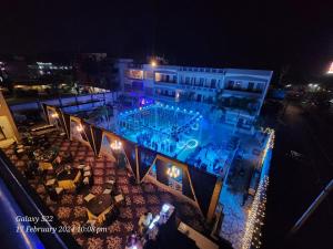 an overhead view of a swimming pool at night at Rani Palace Hotel And Resort in Kishangarh