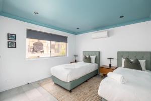 Woodlands Sunsets Soldiers Point - Whole Property客房内的一张或多张床位