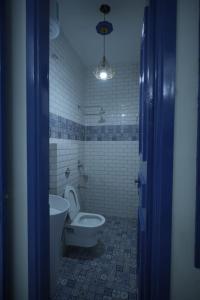 a bathroom with a toilet and a bidet at The Host in Amritsar