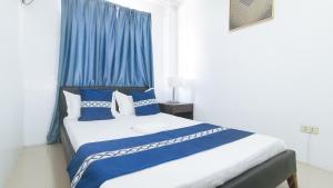 Postel nebo postele na pokoji v ubytování ADC Resort and Hotel Apalit Pampanga