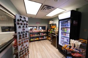 a store with a refrigerator filled with lots of food at The Thompson Hotel in Kamloops