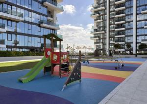 a playground with a slide and a slideintend at Dubai Frame view, 5 mins to Burj Khalifa in Dubai