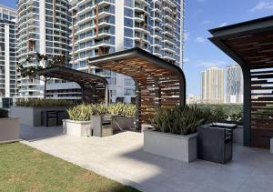 a patio with a bunch of potted plants at Dubai Frame view, 5 mins to Burj Khalifa in Dubai