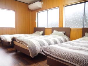 Postel nebo postele na pokoji v ubytování 那智の里 Accommodation along the Kumano Kodo trail